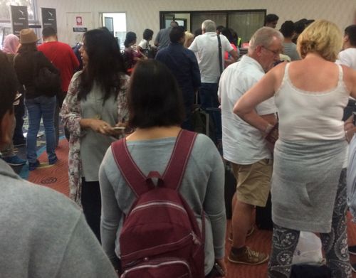 Passengers line up for hotel reservations in Alice Springs. (Donna Edwards)