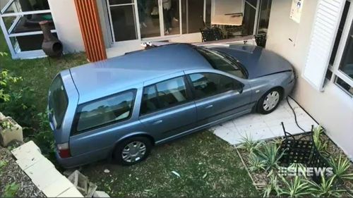 Jackson accidentally knocked his family car into gear, causing it to roll down a driveway, across a busy road and into a neighbour's front yard. Picture: 9NEWS.