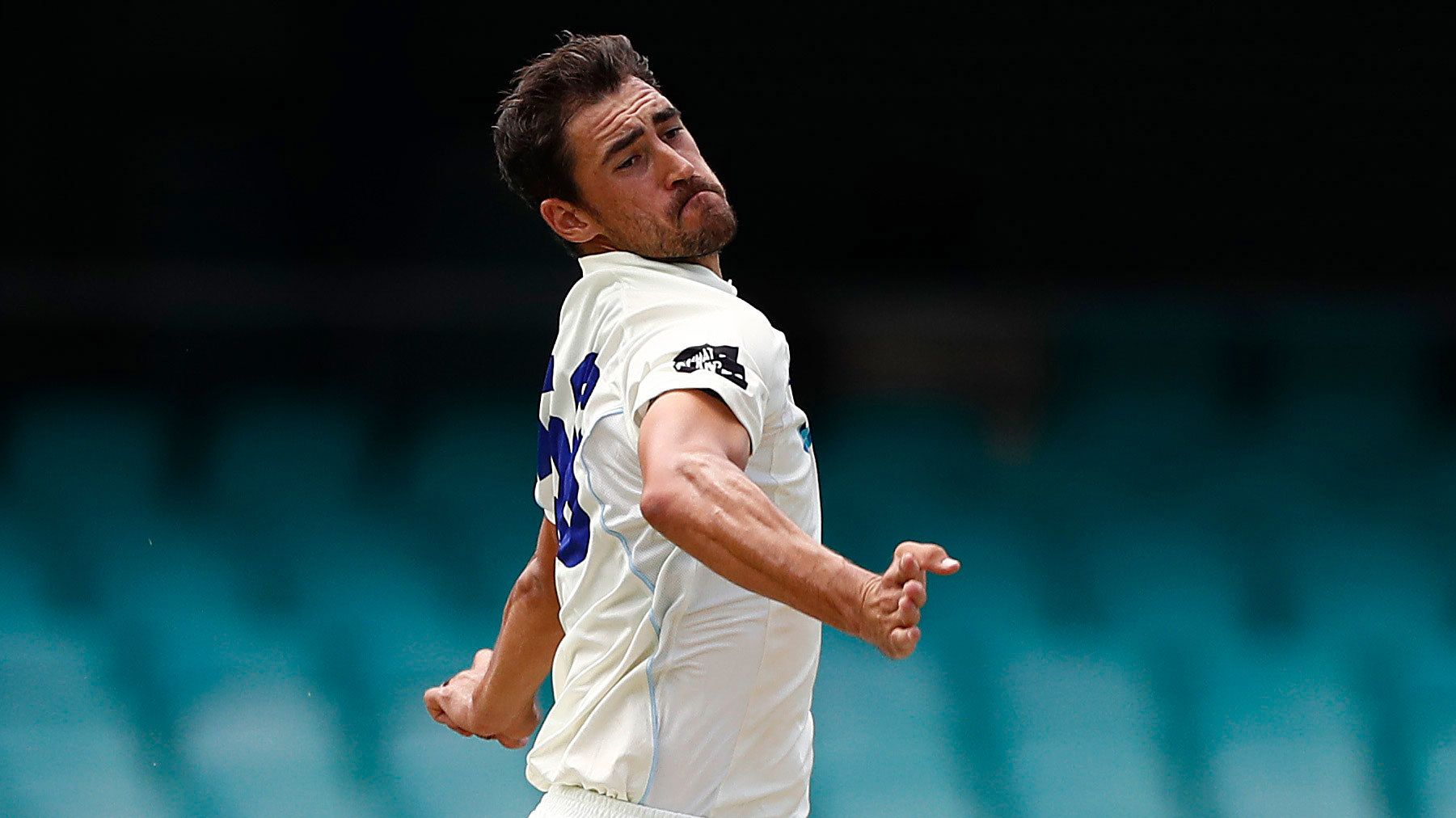 Mitchell Starc bowls for NSW in a Sheffield Shield game.