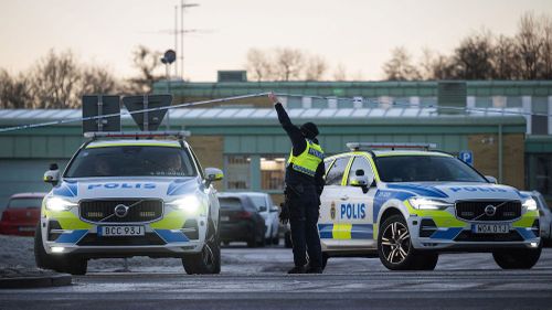 Police officers stand guard outside the Campus Risbergska school in Örebro, Sweden on Thursday, two days after the mass shooting there.(Jonathan Nackstrand/AFP/Getty Images via CNN Newsource.)