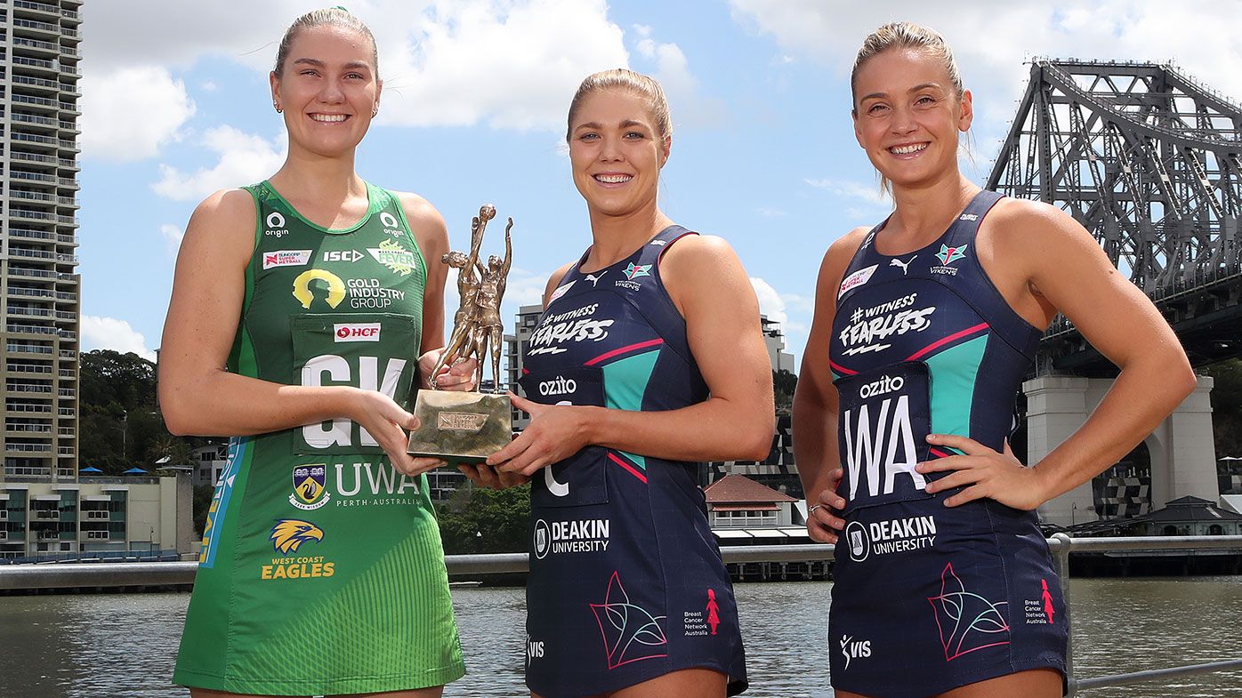 West Coast Fever captain Courtney Bruce and Melbourne Vixens co-captains Kate Moloney and Liz Watson pose with the Super Netball trophy