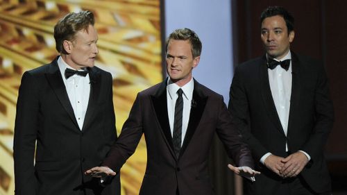 Conan O'Brien, Neil Patrick Harris and Jimmy Fallon on stage at the 65th Primetime Emmy Awards. (AAP)
