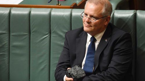 Scott Morrison wields a lump of coal in Parliament.