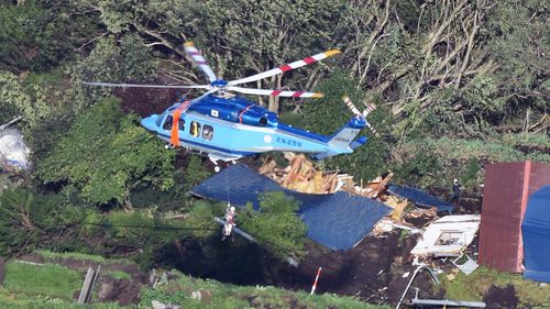 An aerial photo shows houses covered with landslides that seem to be happened by the earthquake in Atsuma Town, Hokkaido