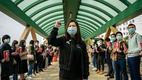 Medical workers hold a strike near Queen Mary Hospital to demand the government shut the city's border with China to reduce the spread of the coronavirus.