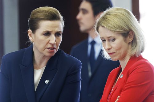 Denmark's Prime Minister Mette Frederiksen, left, speaks with European Union foreign policy chief Kaja Kallas at a round table meeting during an EU summit in Brussels.