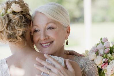 Bride with mother on wedding day. Mother of the bride.