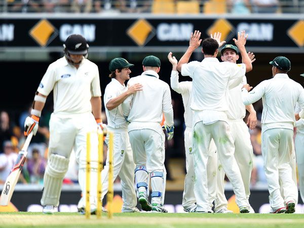 The Australian team celebrate another wicket. (AAP)