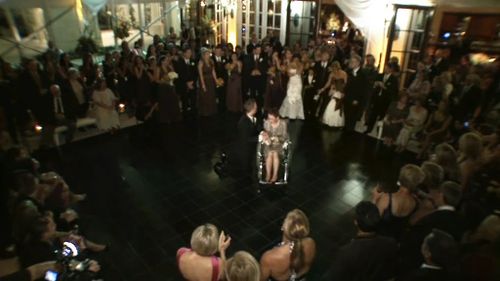 The groom got down on his knees and danced with his wheel-chair bound mother.