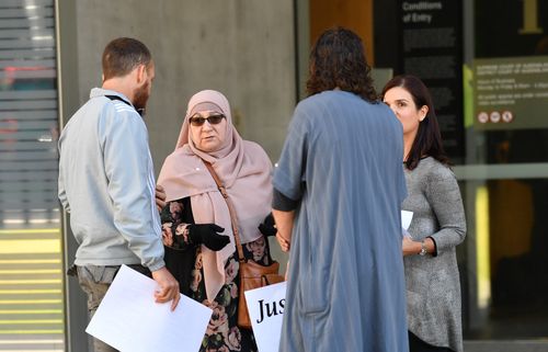 Supporters of Agim Kruezi are seen outside the Brisbane Supreme Court in Brisbane yesterday. Picture: AAP