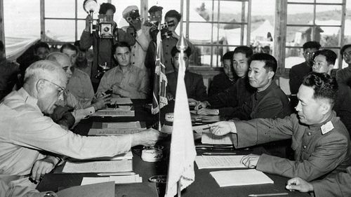 US and North Korean generals sign the 1953 peace armistice at Panmunjom. (AP).