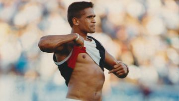 Wayne Ludbey&#x27;s iconic photo of Nicky Winmar after St Kilda defeated Collingwood in 1993. Thirty years on, Collingwood have formally apologised.