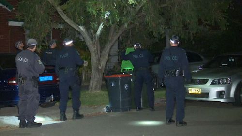 The masked men ransacked the house after tying up the family. (9NEWS)