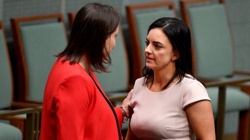 Emma Husar is comforted by Liberal frontbencher Kelly O'Dwyer after an emotional statement made to parliament.