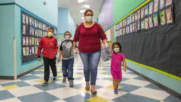 Children in the United States wear masks while at school.