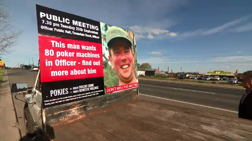 John is campaigning against Tim's bid to build a pub with poker machines.