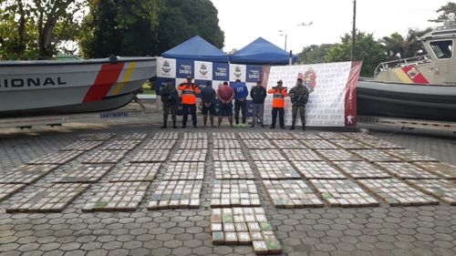 The suspects are seen here with the drug haul.