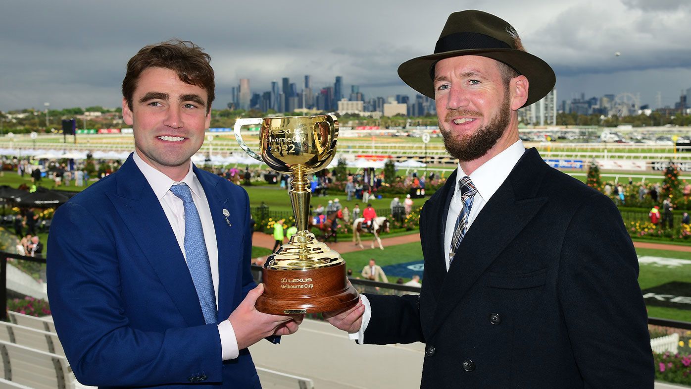 David Eustace and Ciaron Maher pose with the 2022 Melbourne Cup trophy after Gold Trip&#x27;s victory