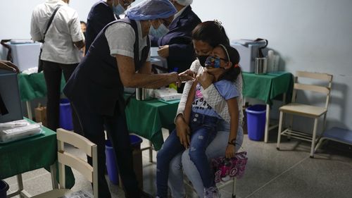 A child cries out as she is inoculated during a free vaccination campaign for polio, rubella and influenza organized by the Health Ministry in Caracas, Venezuela, Saturday, June 18, 2022. An Associated Press analysis of rare government data and estimates from public health agencies shows that Venezuelas vaccination crisis is growing, putting it among the worlds worst countries for getting required shots that protect young children against potentially fatal diseases. (AP Photo/Ariana Cubillos)