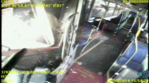 Witnesses reporting hearing a big bang when the bus crashed. No one was injured. (9NEWS)