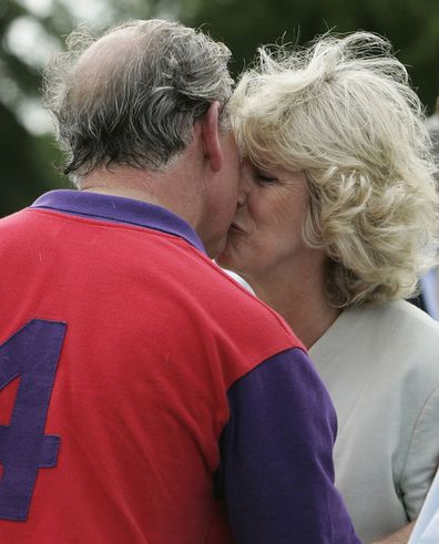 Prince Charles wins a prize and a kiss from his wife Camilla the Duchess of Cornwall after polo at Cirencester on June 17, 2005 in Cirencester, England.