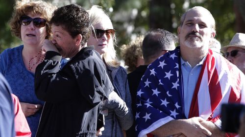 Mourners and residents lined the streets for the procession in a show of respect for the sergeant who lost his life trying to protect the college students at the California bar.