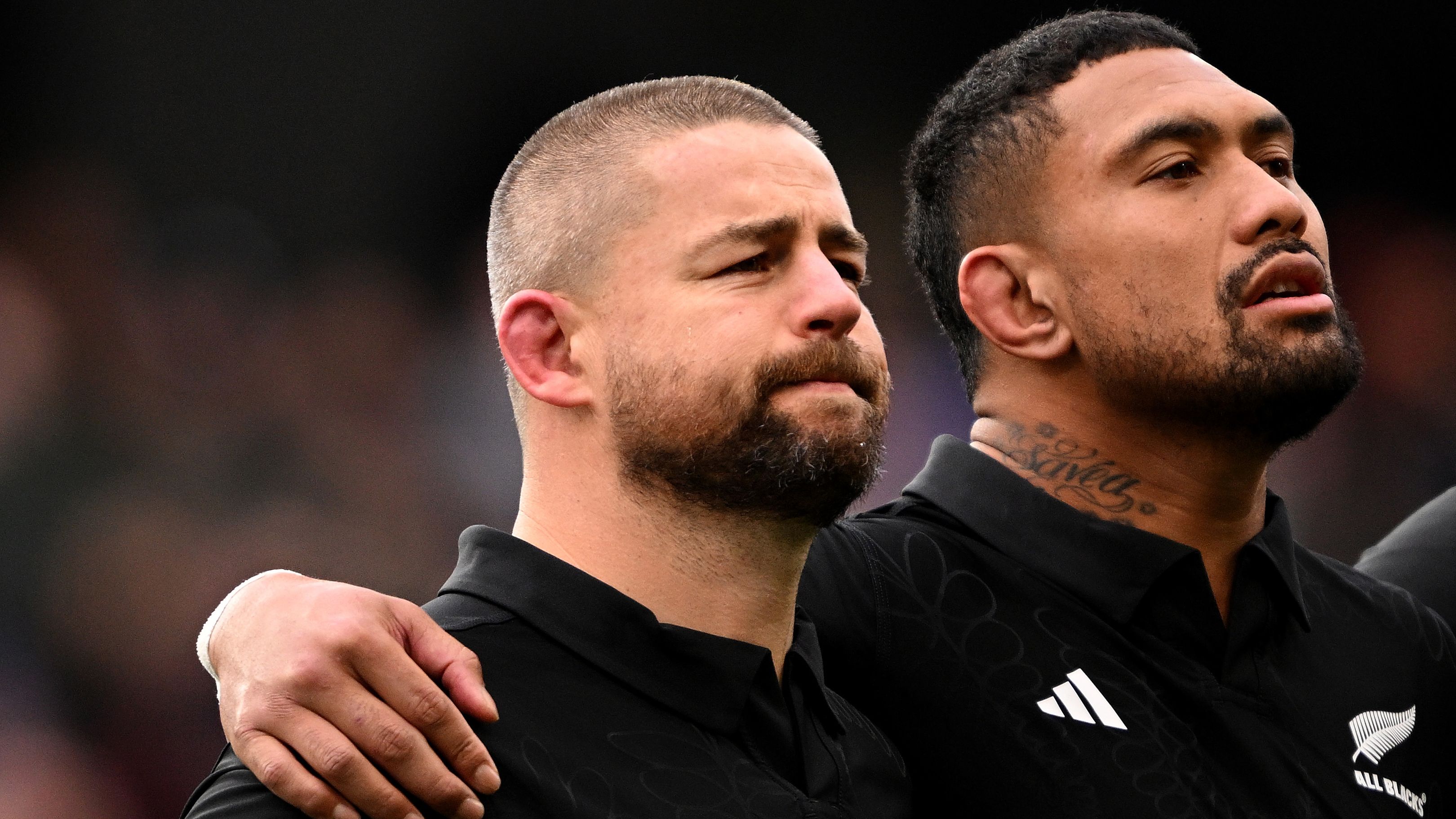 Dane Coles and Ardie Savea of New Zealand stand for the national anthems.