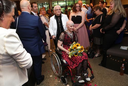 Heather wheeled Cas into the ceremony as John Legend's "All of Me" was played. (AAP)