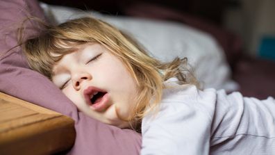 Girl sleeping in bed