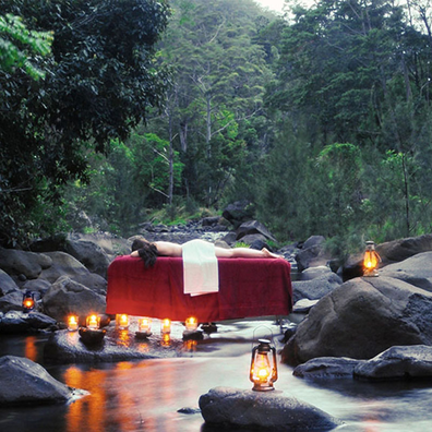 Scenic Rim woman gets outdoor massage in a creek