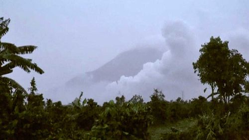 Hot clouds of ash rise from Mount Sinabung, in Tanah Karo, North Sumatra, Indonesia. (AP)