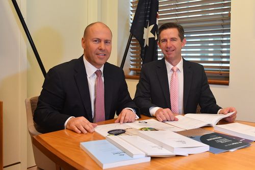 Treasurer Josh Frydenberg and Minister for Finance Simon Birmingham with the Budget papers in Canberra.