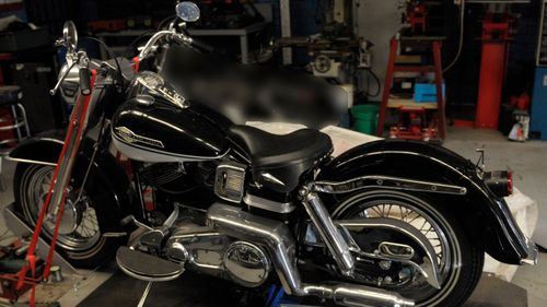 One of the three black Harley Davidson motorcycles.