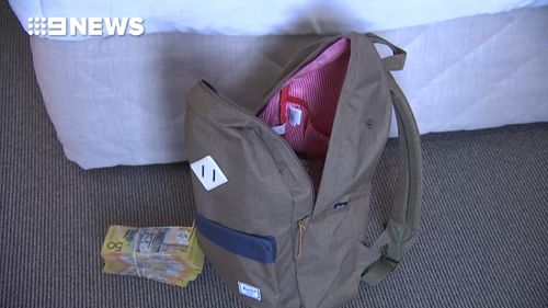 More than $7000 in cash was seized during the raids. (9NEWS)