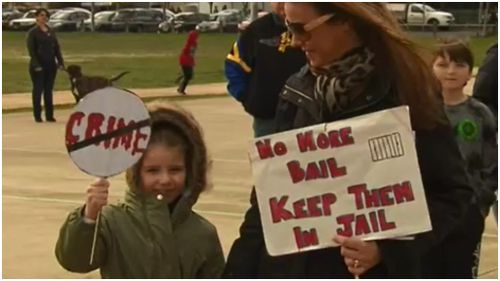 Children and their parents protested for larger numbers of police. (9NEWS)