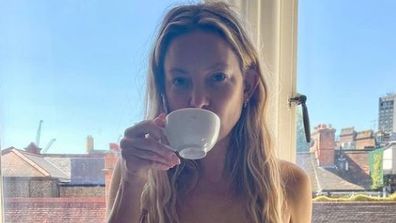 Kate Hudson shares topless photo of herself drinking coffee.