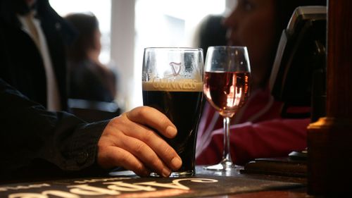 People enjoy drinks at a pub. (AAP)