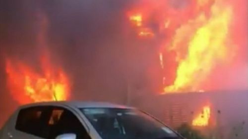 Neighbours have described the fire at Marsfield as "frightening" as it engulfed the home. (9NEWS)
