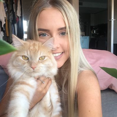 Ireland Hicks with her cat Saylor, who has been in her life for five years.