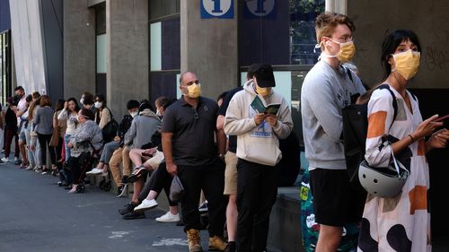 People are seen lining up to get tested for Coronavirus at the Royal Melbourne Hospital  on Tuesday 10 March 2020.  