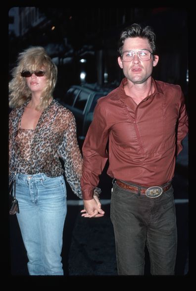 (Original Caption) : Goldie Hawn and Kurt Russell outdoors at night, holding hands. Undated photograph.   (Photo by LGI Stock/Corbis/VCG via Getty Images)