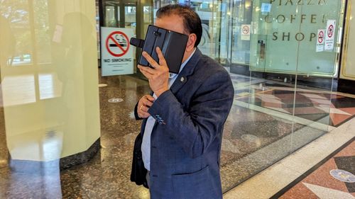 Davendar Deo departs the Downing Centre District Court in Sydney. NAB scam fraud trial $21 million 