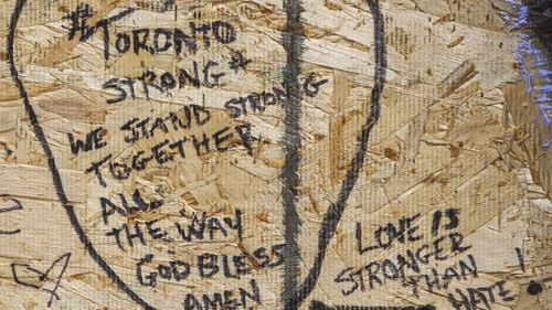 Messages written on makeshift memorial in Greektown, Toronto. (AAP)