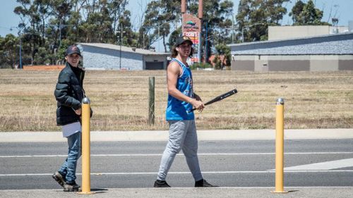 Two thugs seen walking around Wyndham Vale station with weapons.