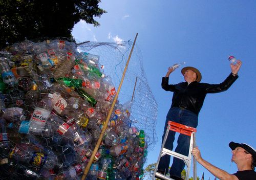 In 2005 Clean Up Australia chairman Ian Kiernan deposits plastic drink bottles in a huge waste basket set up in Sydney's Hyde Park after announcing a refund scheme to encourage people to recycle their plastic bottles.