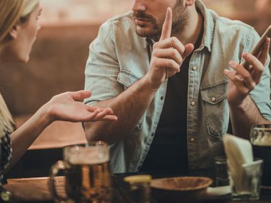 Couple arguing at dinner