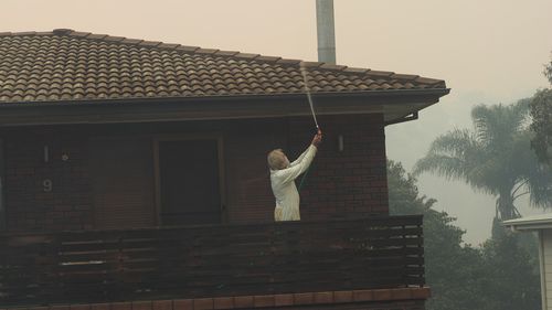 Some residents were able to hose down their properties before fleeing. Picture: Supplied