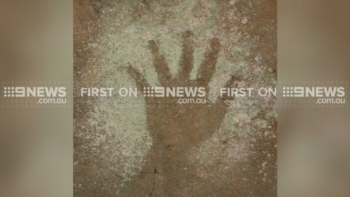 ANCIENT HANDPRINT: Treasure trove of Aboriginal art found in Sydney suburb