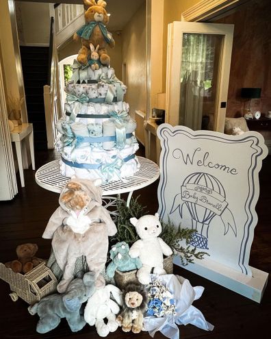 Inside Martha Kalifatidas' baby shower - welcome sign alongside stuffed teddies and tower of baby towels.