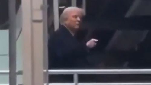 Donald Trump pointed at and appeared to swear at a factory worker who called him a "pedophile protector".